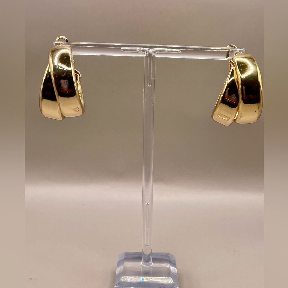 Interwoven chunky hoop earrings. Gold tone for pierced ears. Lever back closure